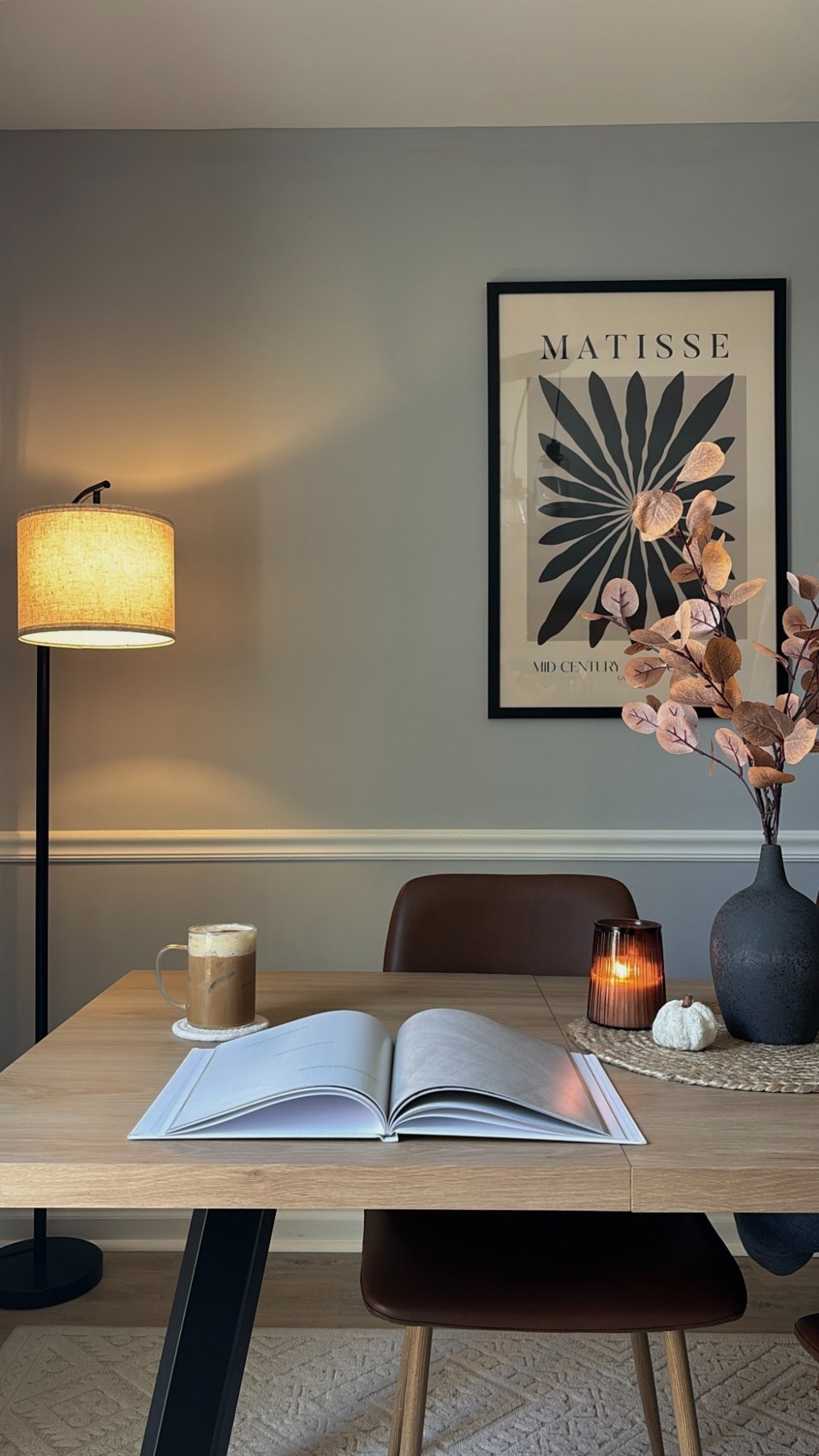 Quiet desk with an open book and coffee