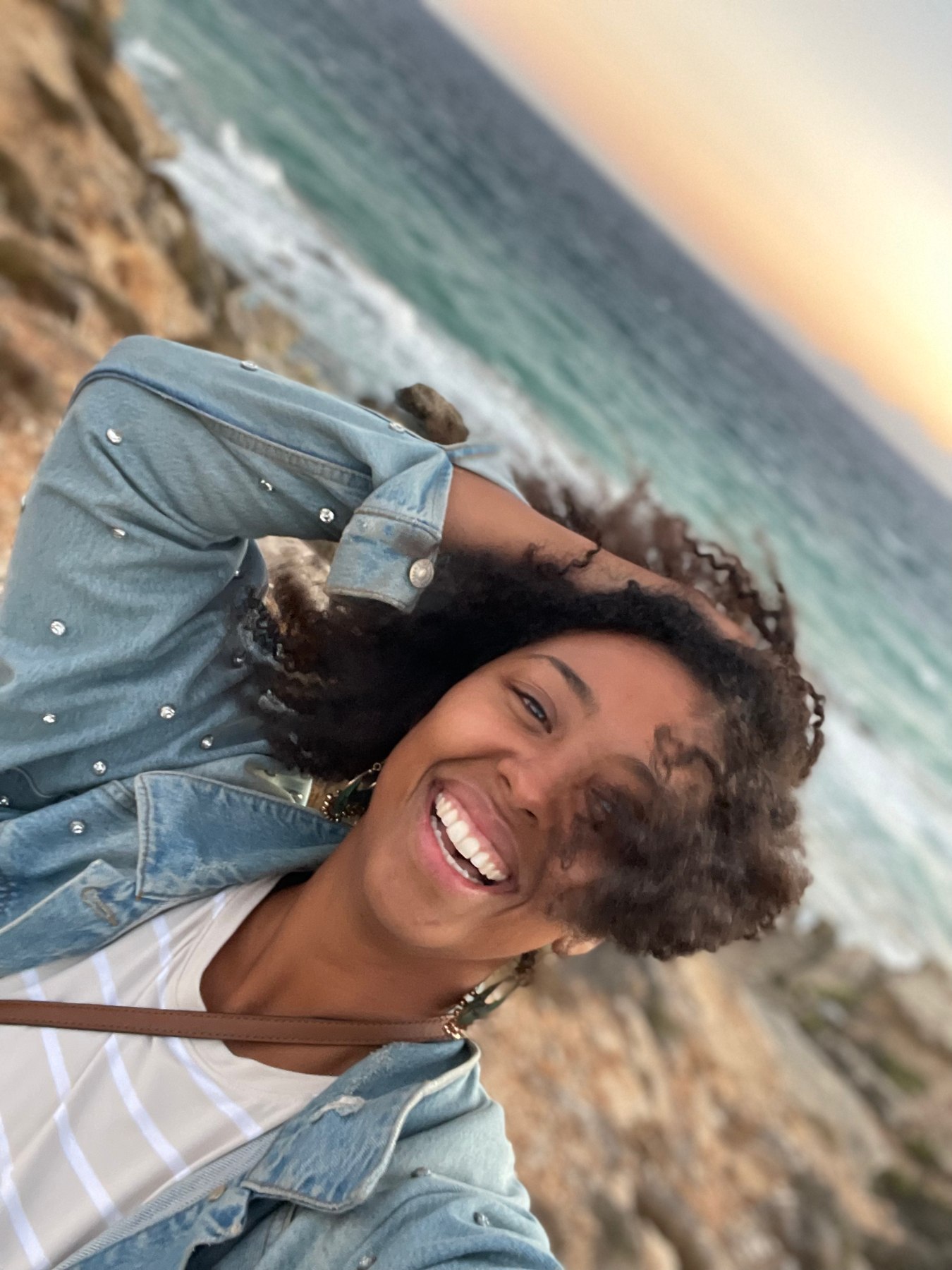 Sidney smiling by the water